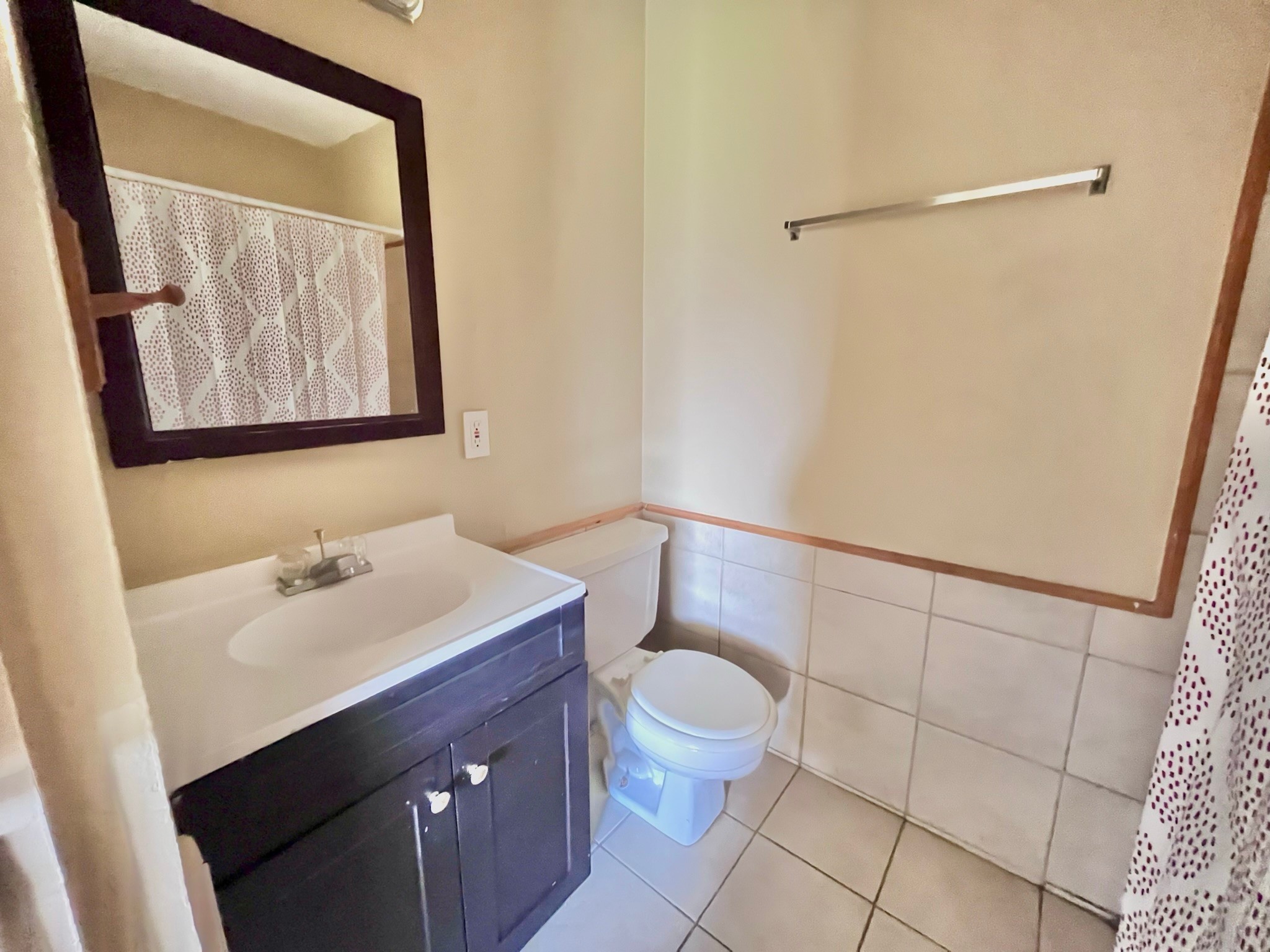 3021 Sycamore Avenue, Unit 10 Bay City, TX 77414 - Photo 6 of 12 a bathroom with a sink mirror vanity and toilet