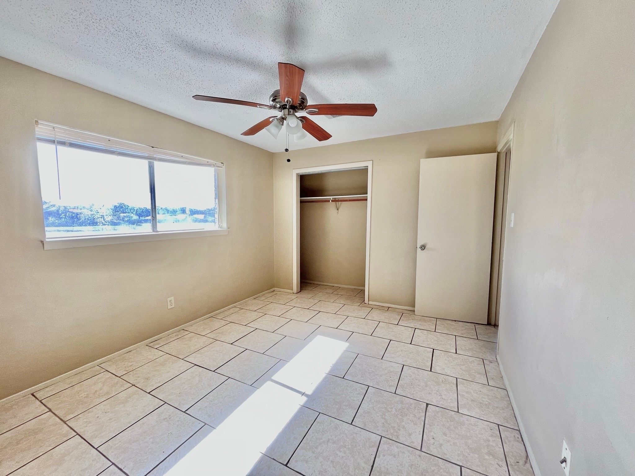 3021 Sycamore Avenue, Unit 10 Bay City, TX 77414 - Photo 8 of 12 a view of an empty room and window