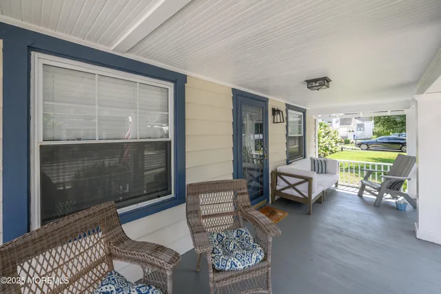 a living room with furniture and a garden