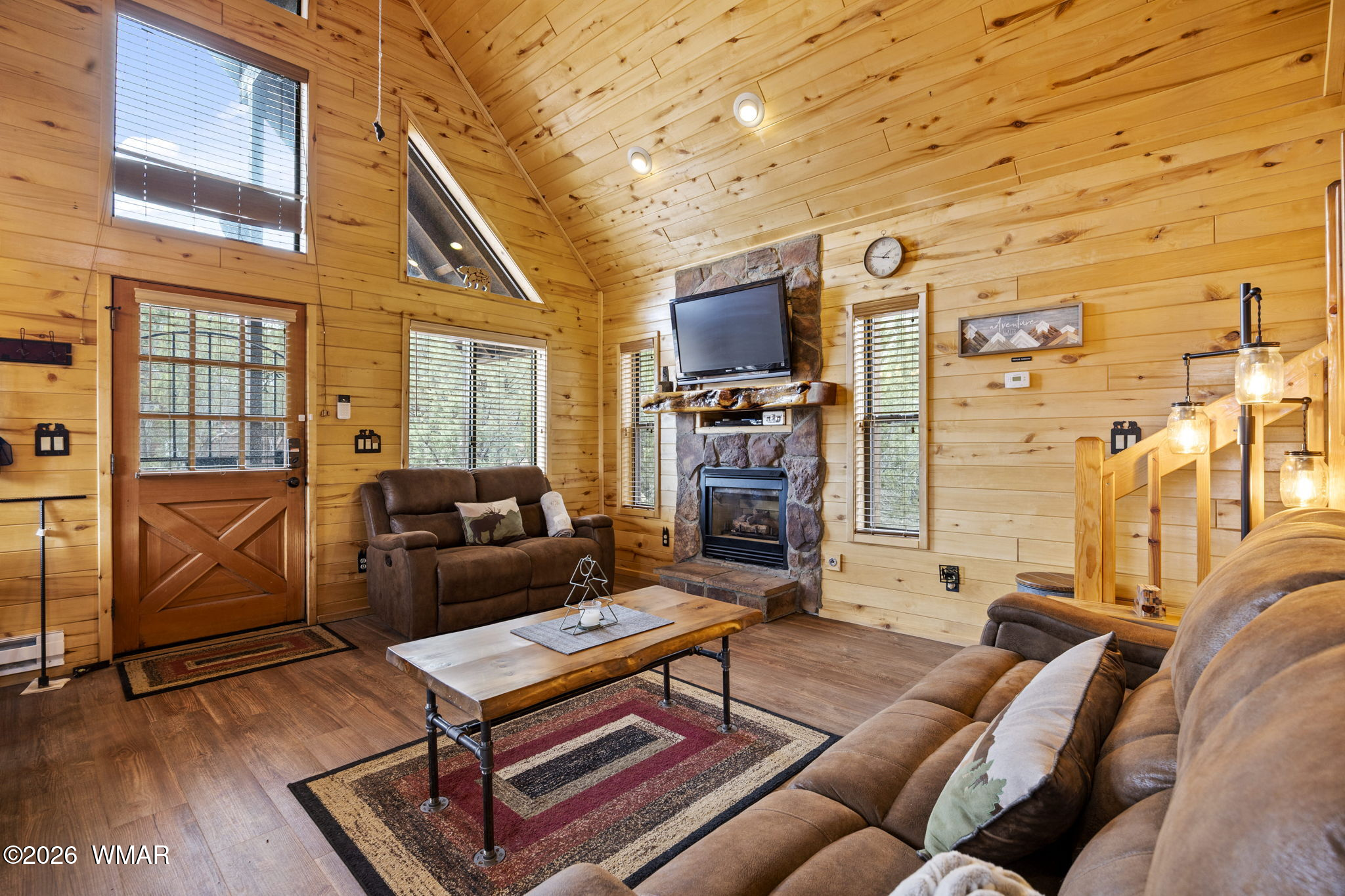 2741 Elk Trail Road Overgaard, AZ 85933 - Photo 39 of 68 a living room with furniture a rug and a flat screen tv