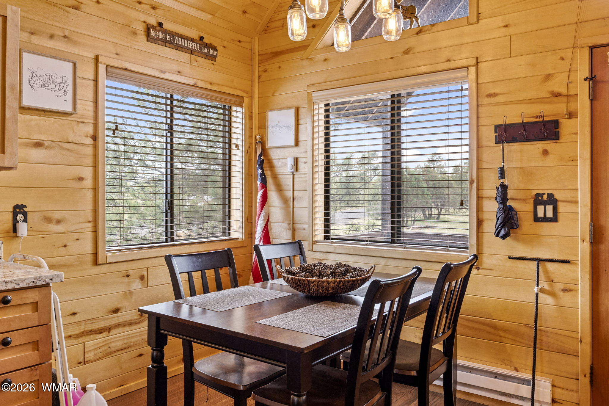 2741 Elk Trail Road Overgaard, AZ 85933 - Photo 42 of 68 a view of a dining room with furniture and windows