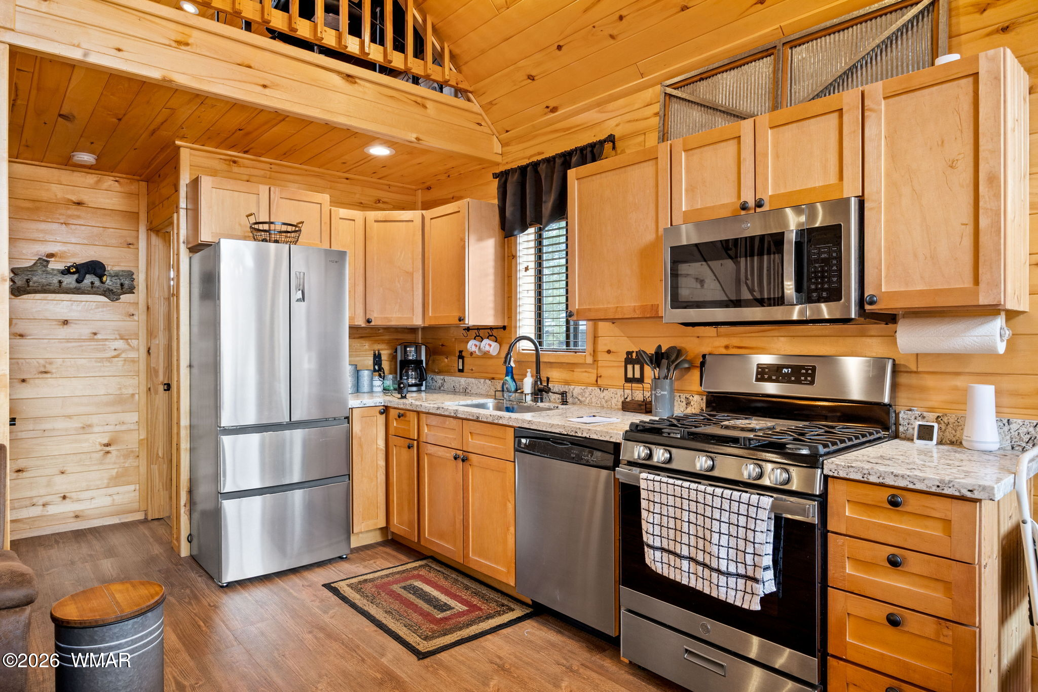 2741 Elk Trail Road Overgaard, AZ 85933 - Photo 43 of 68 a kitchen with stainless steel appliances a refrigerator stove and microwave