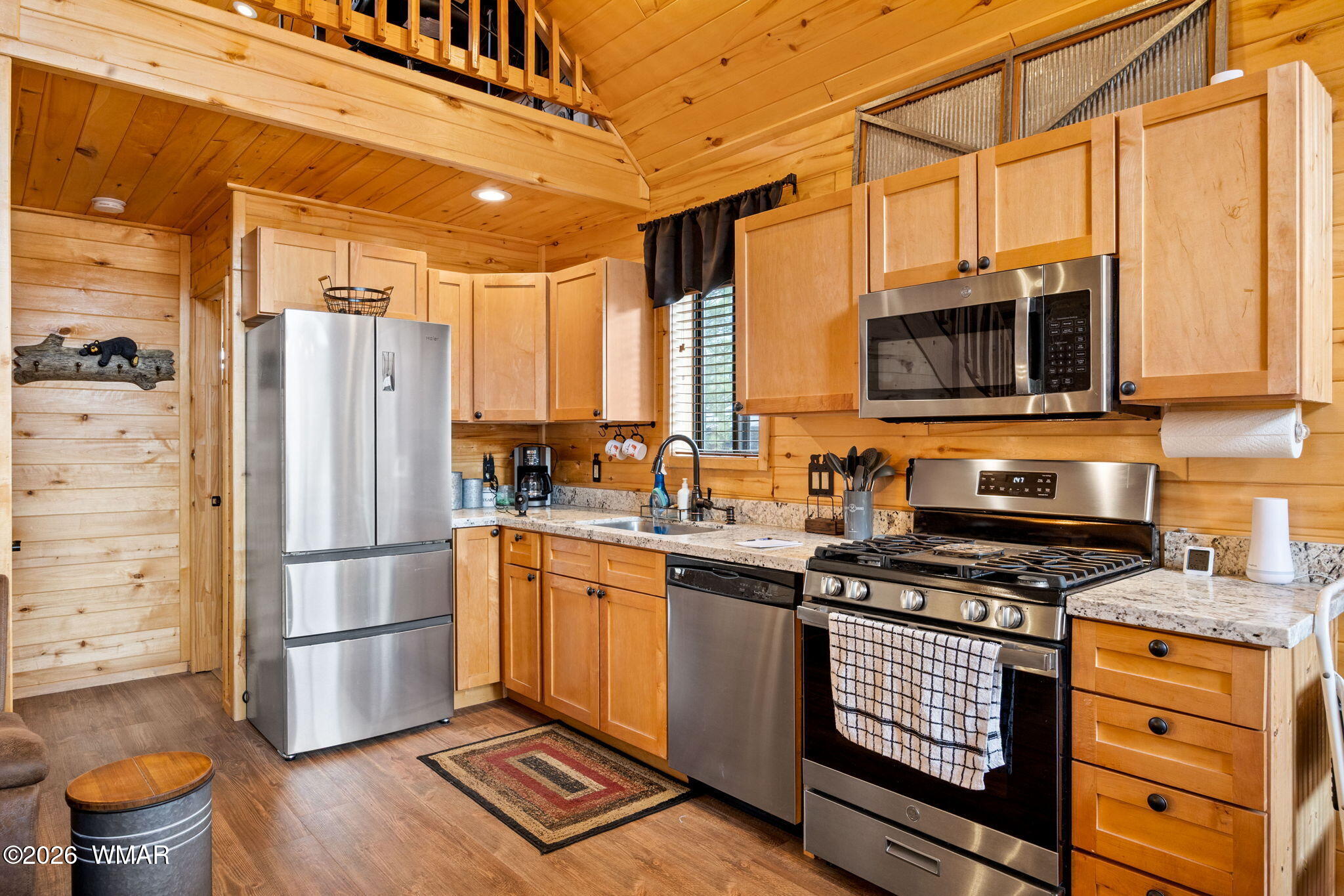 2741 Elk Trail Road Overgaard, AZ 85933 - Photo 11 of 68 a kitchen with stainless steel appliances a refrigerator stove and microwave