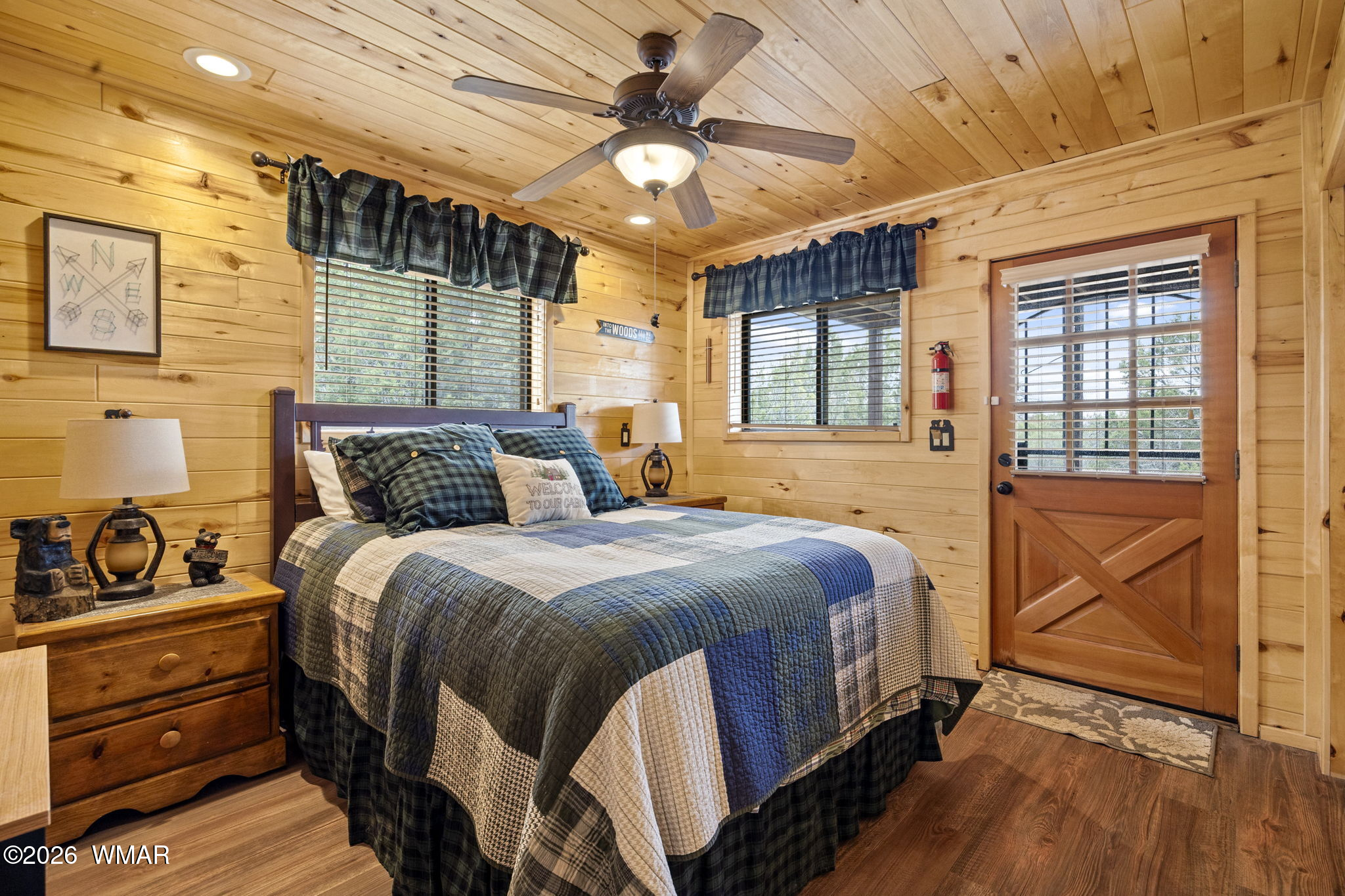 2741 Elk Trail Road Overgaard, AZ 85933 - Photo 45 of 68 a bedroom with a bed and wooden floor