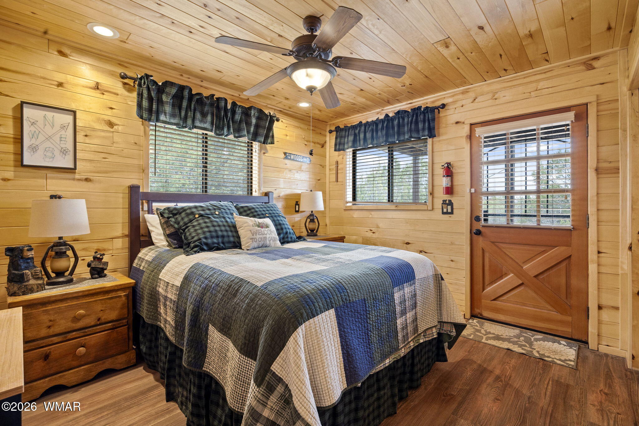 2741 Elk Trail Road Overgaard, AZ 85933 - Photo 13 of 68 a bedroom with a bed and wooden floor