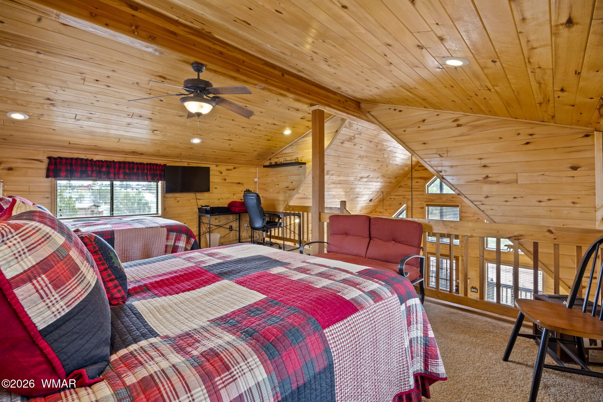 2741 Elk Trail Road Overgaard, AZ 85933 - Photo 50 of 68 a bedroom with a bed a ceiling fan and a large window