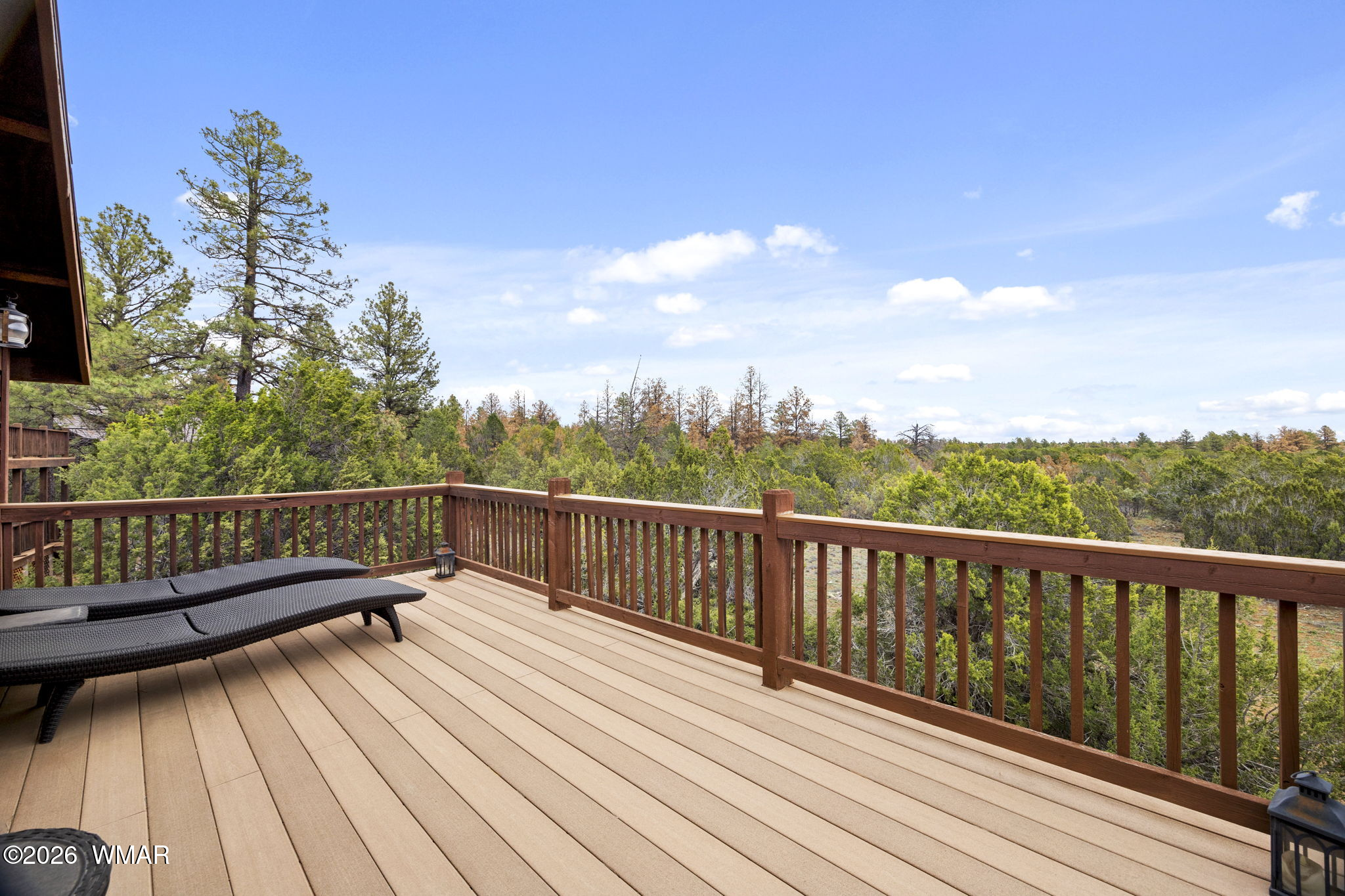 2741 Elk Trail Road Overgaard, AZ 85933 - Photo 51 of 68 a view of balcony with wooden floor and fence