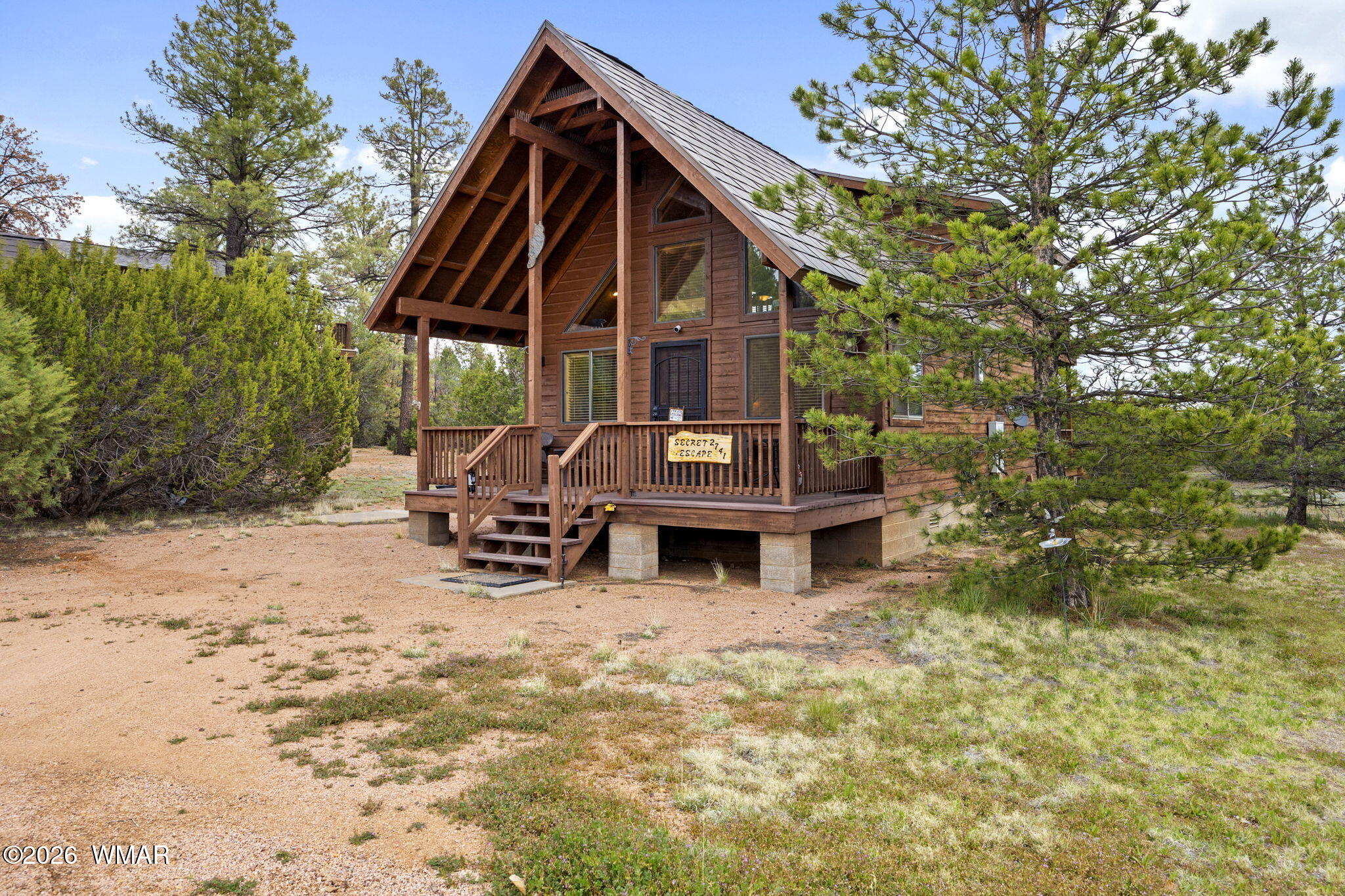 2741 Elk Trail Road Overgaard, AZ 85933 - Photo 2 of 68 a view of a house with a yard