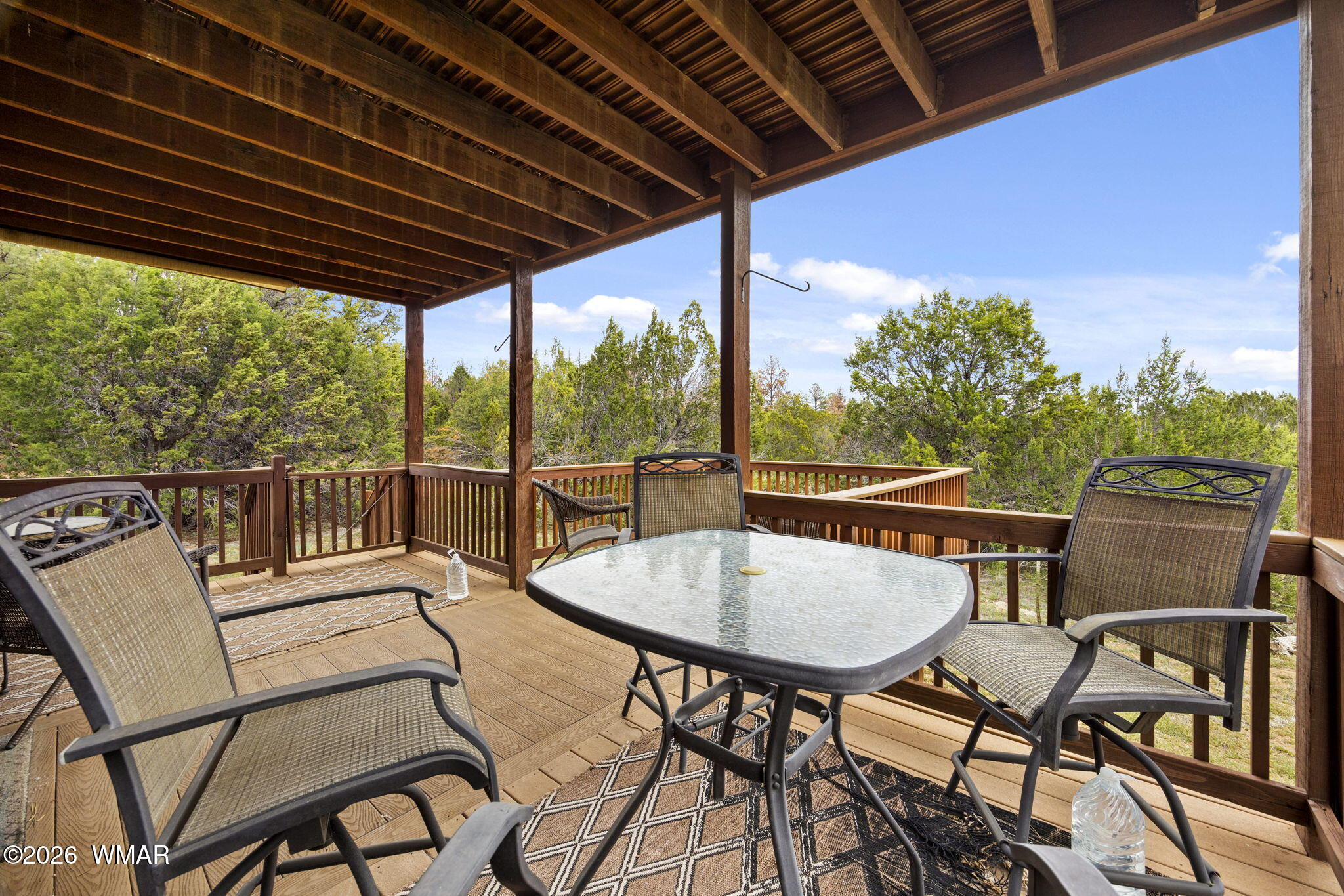 2741 Elk Trail Road Overgaard, AZ 85933 - Photo 21 of 68 a view of a chairs and table in the patio