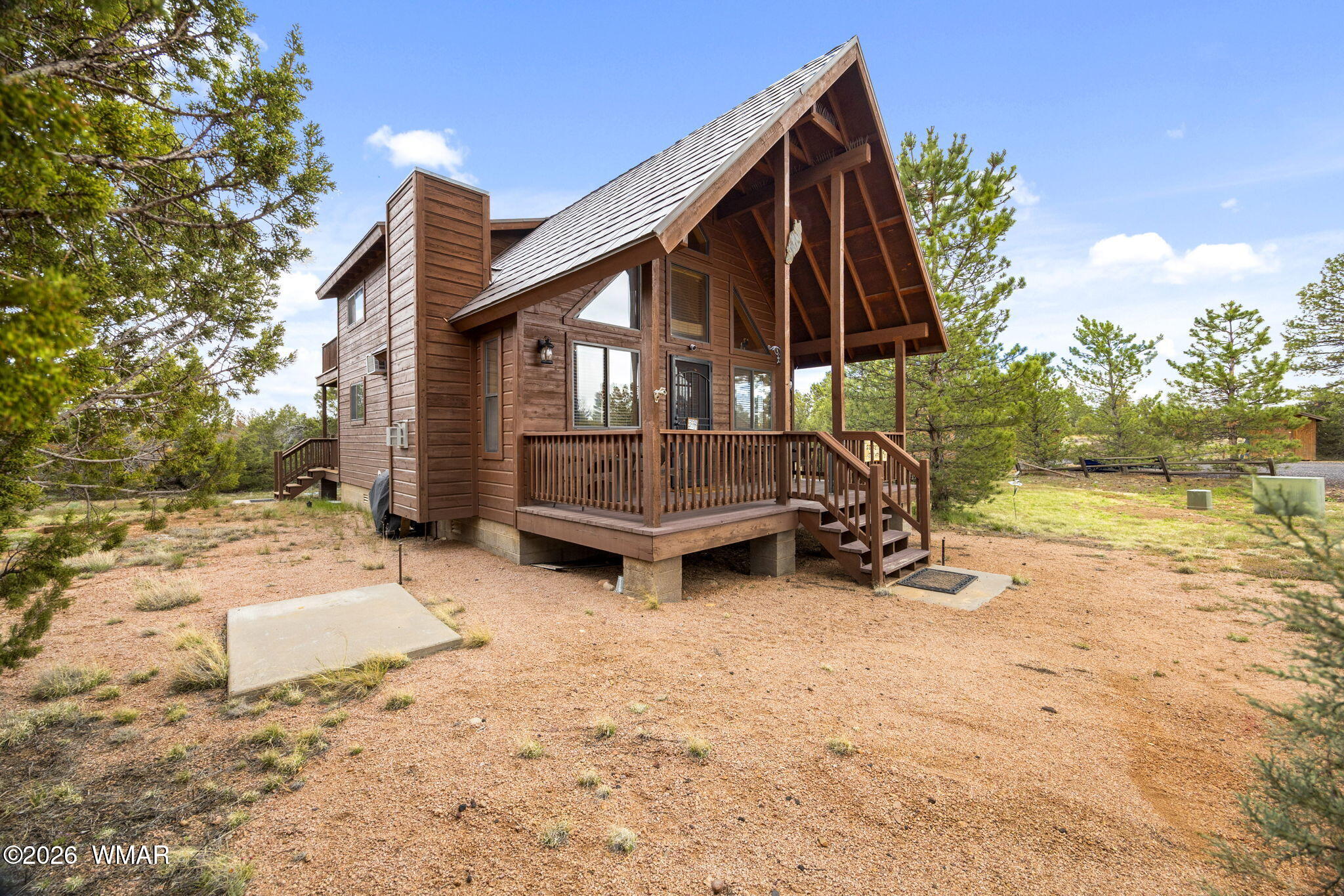 2741 Elk Trail Road Overgaard, AZ 85933 - Photo 4 of 68 a view of a house with backyard and sitting area