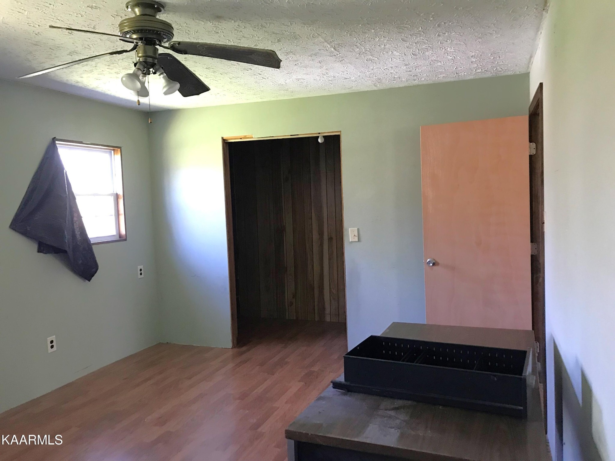 1679 Hillendale Road Crossville, TN 38572 - Photo 26 of 52 a bedroom with a bed and a chandelier fan