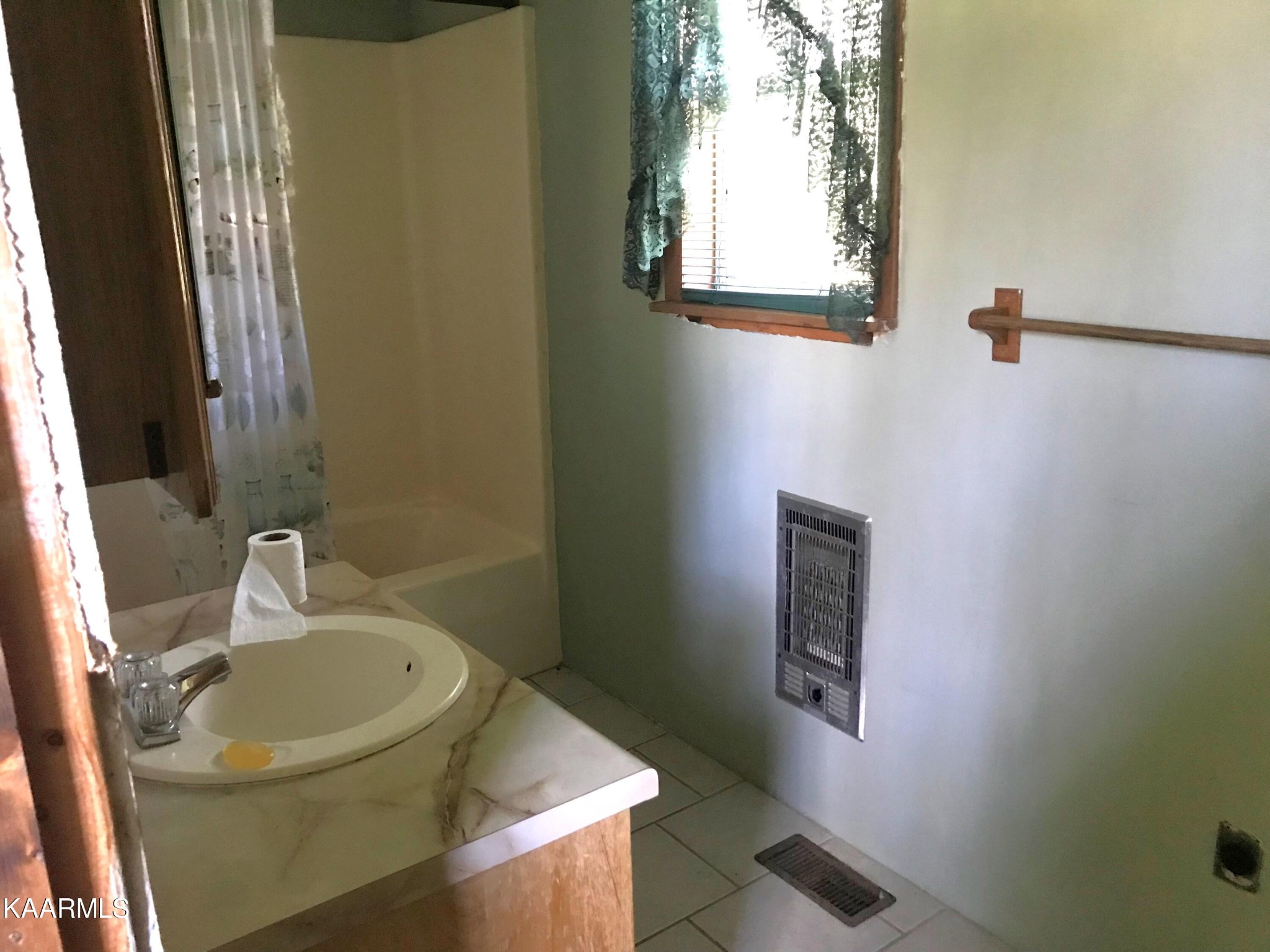 1679 Hillendale Road Crossville, TN 38572 - Photo 28 of 52 a bathroom with a sink and a mirror