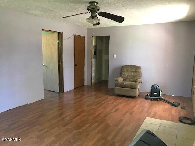 1679 Hillendale Road Crossville, TN 38572 - Photo 30 of 52 a living room with furniture and a wooden floor