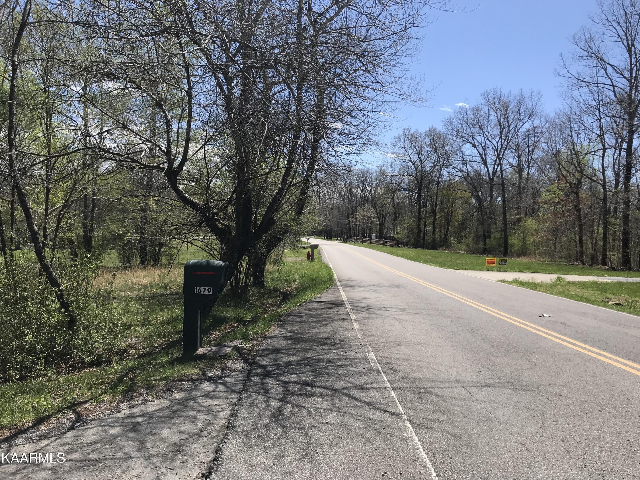 1679 Hillendale Road Crossville, TN 38572 - Photo 51 of 52 a view of a yard with plants and trees