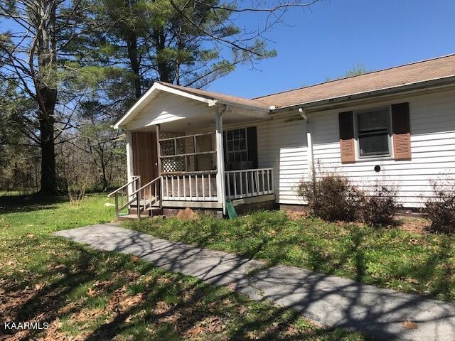 1679 Hillendale Road Crossville, TN 38572 - Photo 6 of 52 a front view of a house with a yard