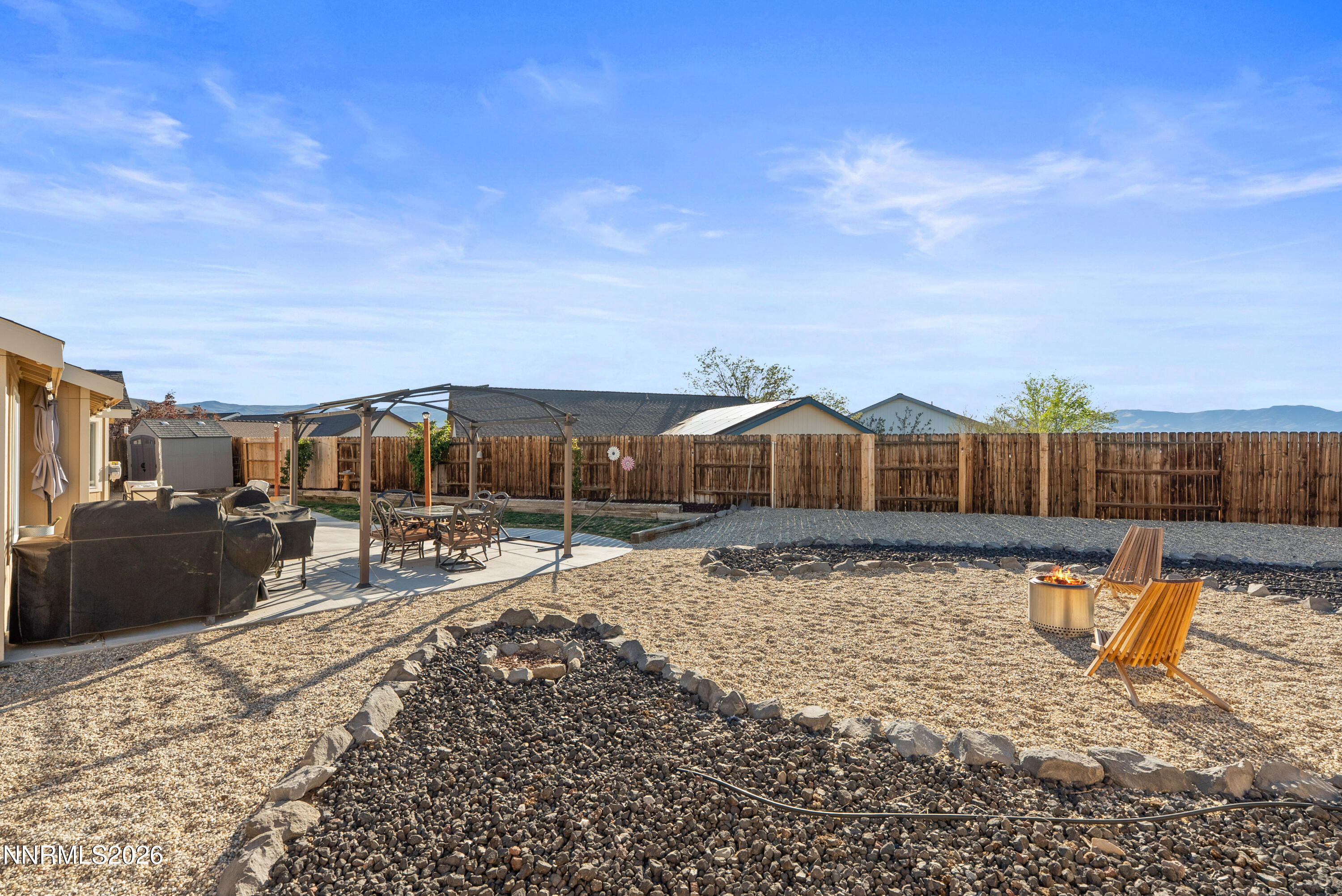 552 Spur Court Fernley, NV 89408 - Photo 40 of 46 a view of a house with backyard and sitting area