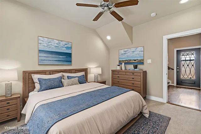 a bedroom with a bed and ceiling fan