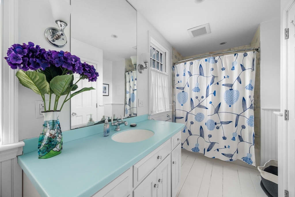 31 Lincoln House Point Swampscott, MA 01907 - Photo 16 of 33 a bathroom with a sink vanity and a mirror