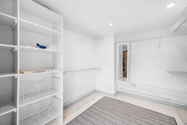 a view of an empty walk in closet