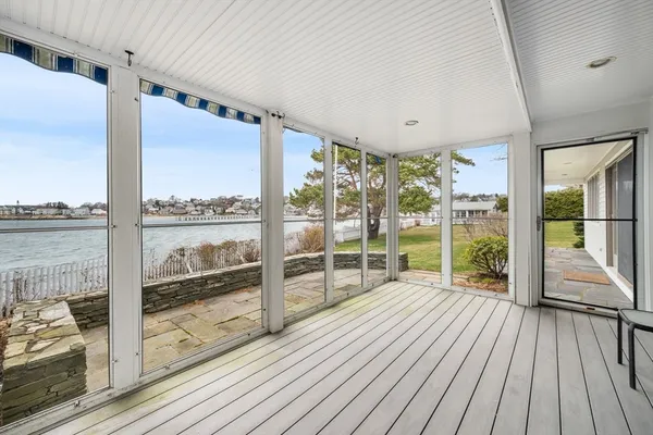 a view of a room with wooden floor and city view