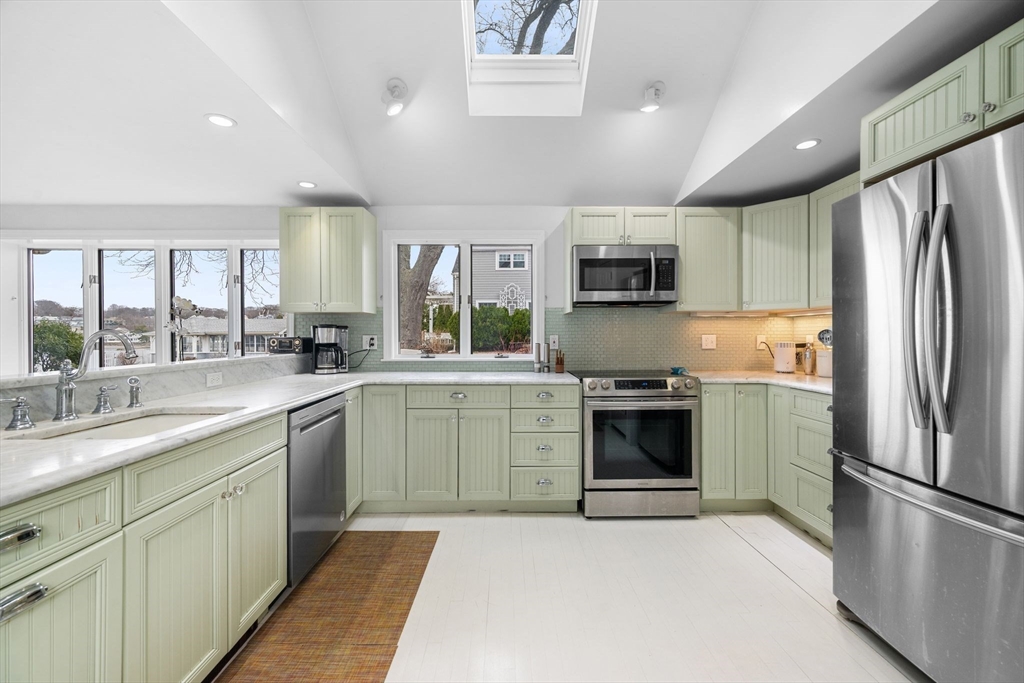 31 Lincoln House Point Swampscott, MA 01907 - Photo 5 of 33 a kitchen with a refrigerator sink and microwave