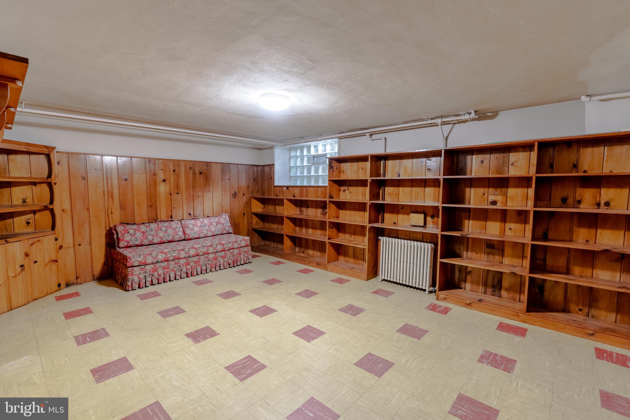 3718 Delverne Road Baltimore, MD 21218 - Photo 15 of 24 a room with a book shelf