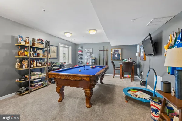 a room with furniture and a book shelf