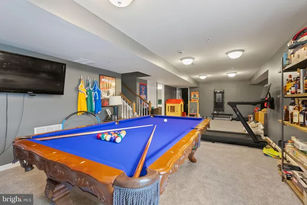 a room with furniture and a flat screen tv