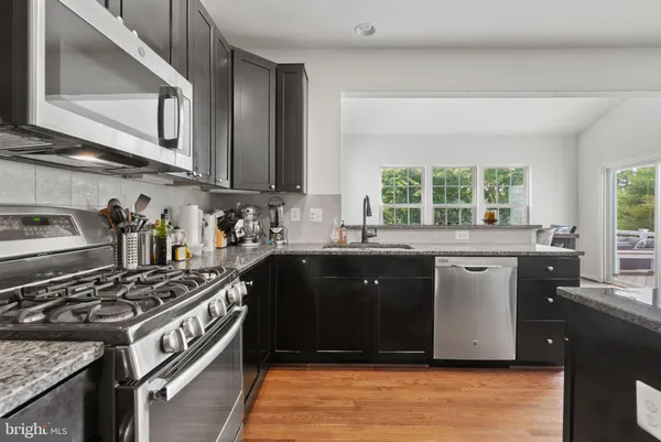 a kitchen with a stove and a sink