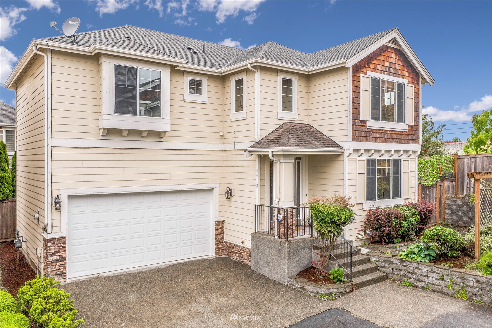 4412 Northeast 3rd Lane Renton, WA 98059 - Photo 1 of 26 a front view of a house with a yard and garage