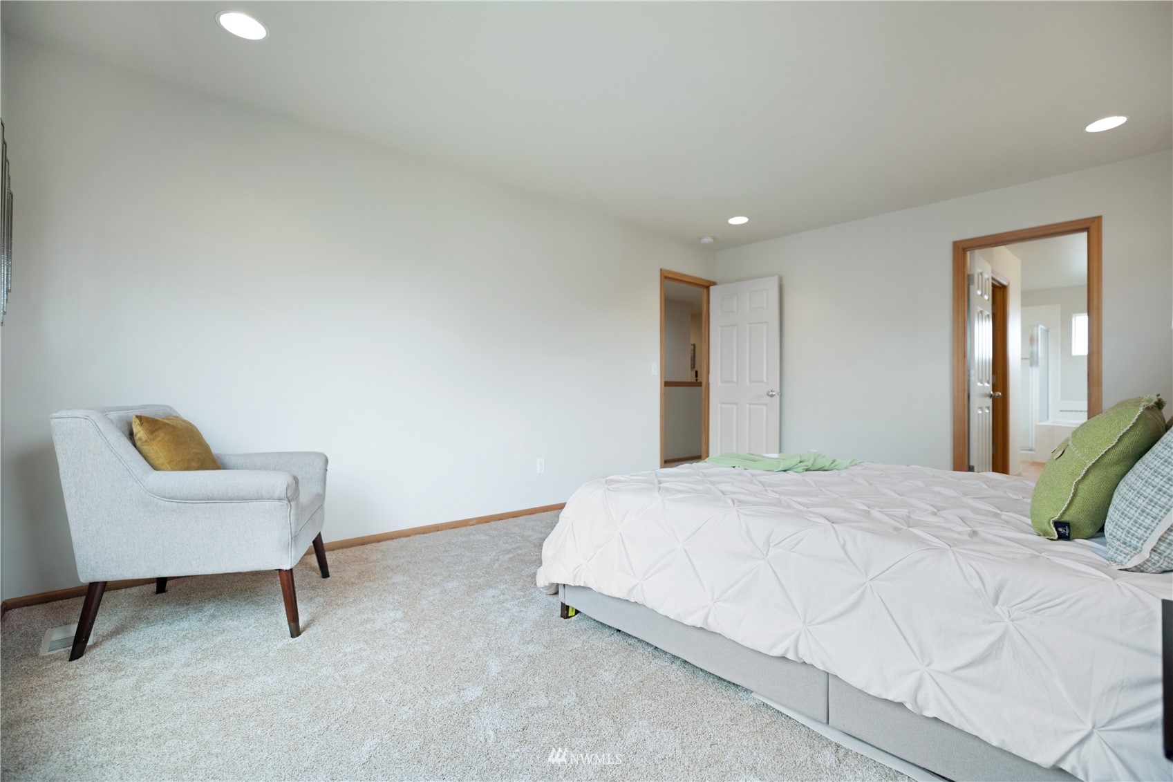 4412 Northeast 3rd Lane Renton, WA 98059 - Photo 17 of 26 a bedroom with a bed and a chair