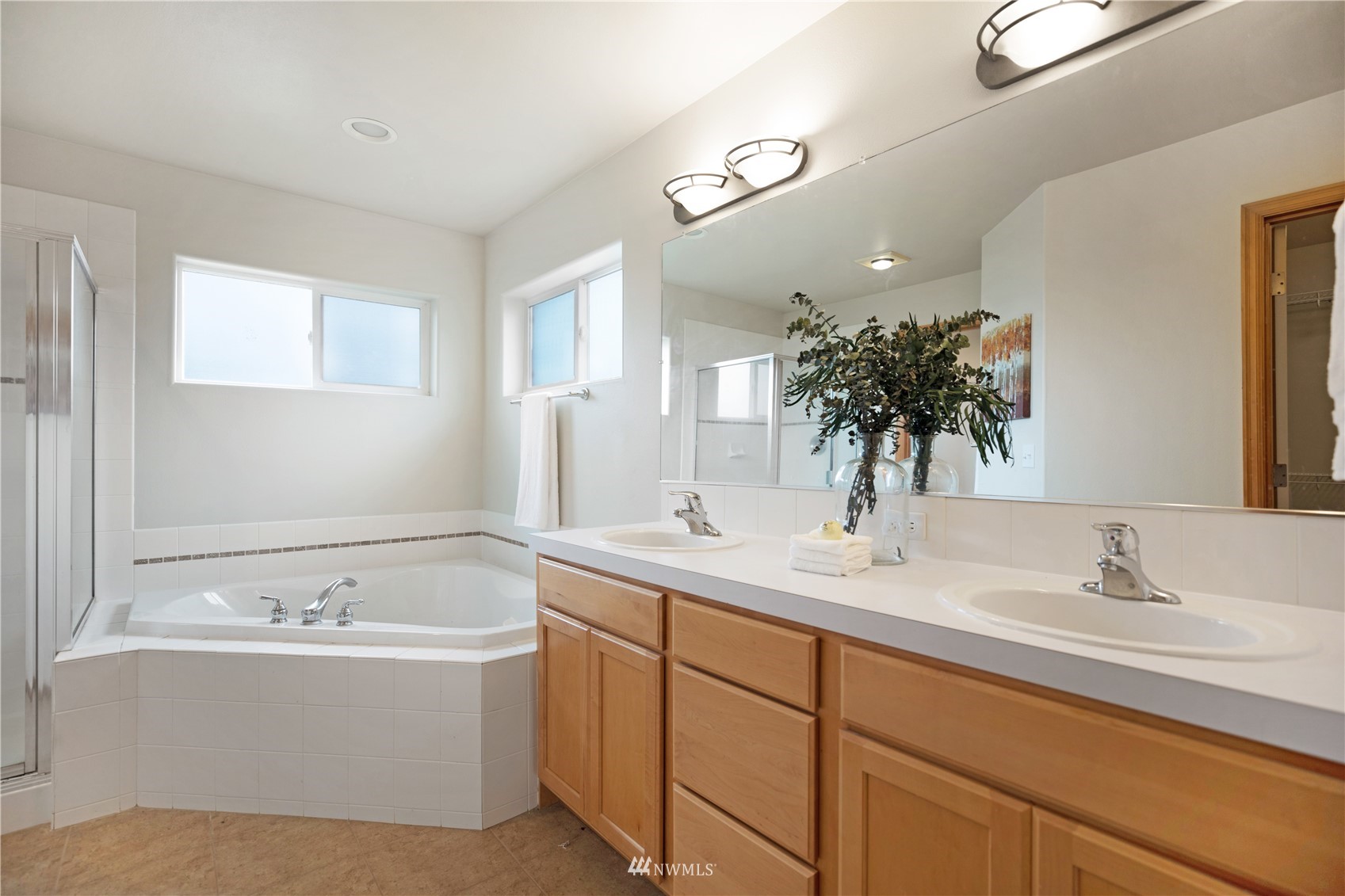 4412 Northeast 3rd Lane Renton, WA 98059 - Photo 18 of 26 a bathroom with a tub sink and mirror