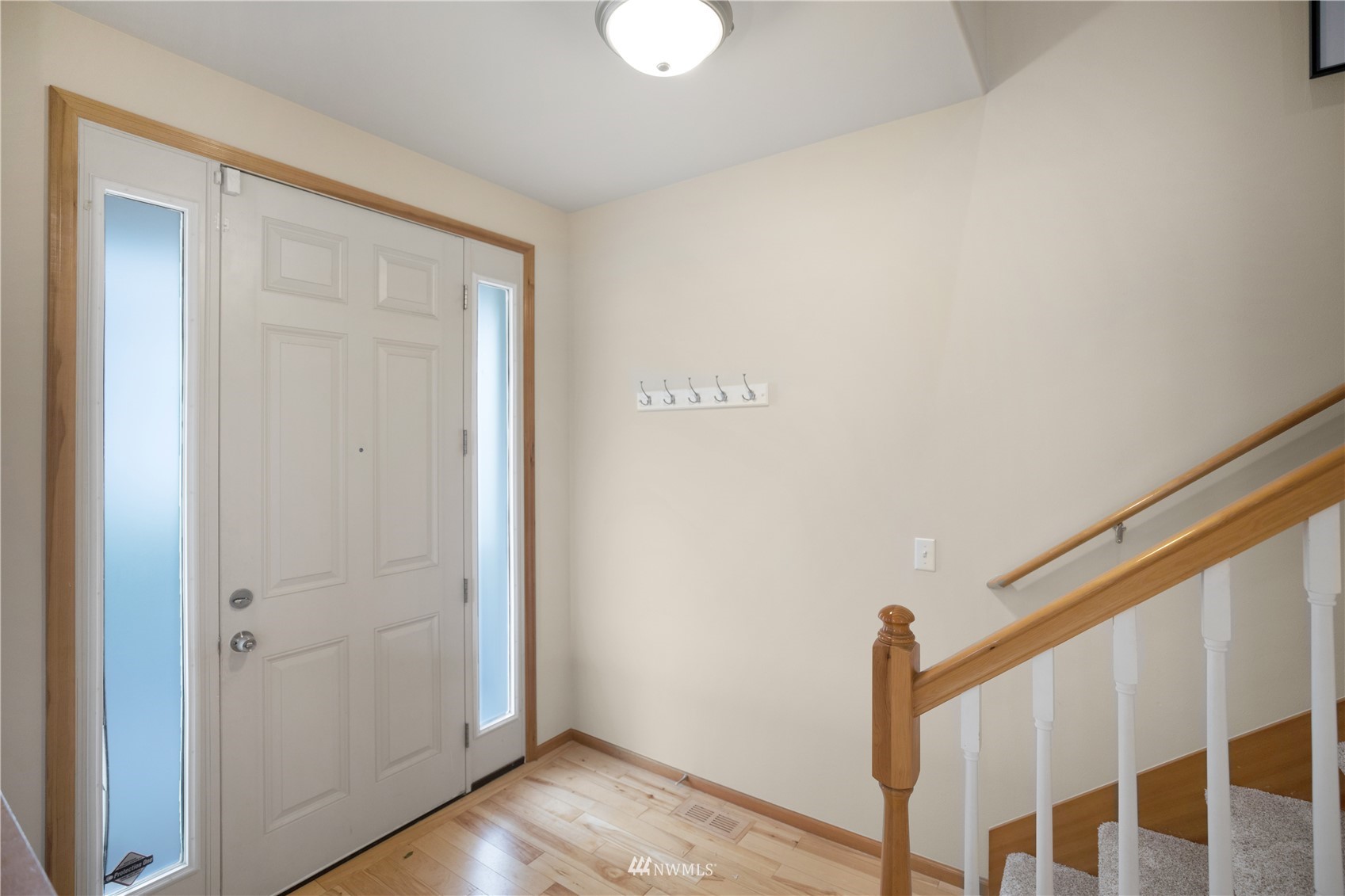 4412 Northeast 3rd Lane Renton, WA 98059 - Photo 5 of 26 a view of a hallway with wooden floor and closet