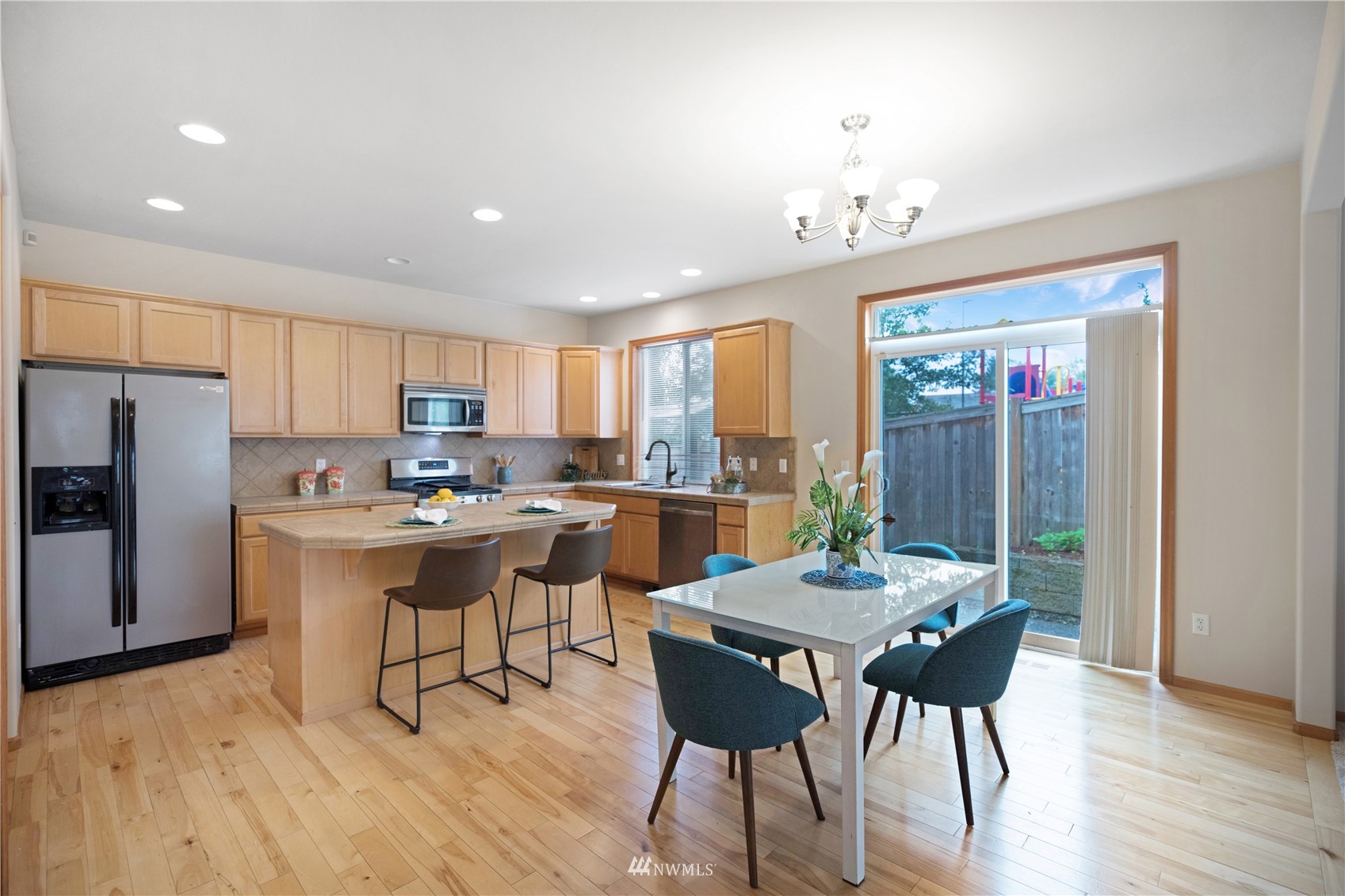 4412 Northeast 3rd Lane Renton, WA 98059 - Photo 7 of 26 a view of a dining room with furniture window and wooden floor