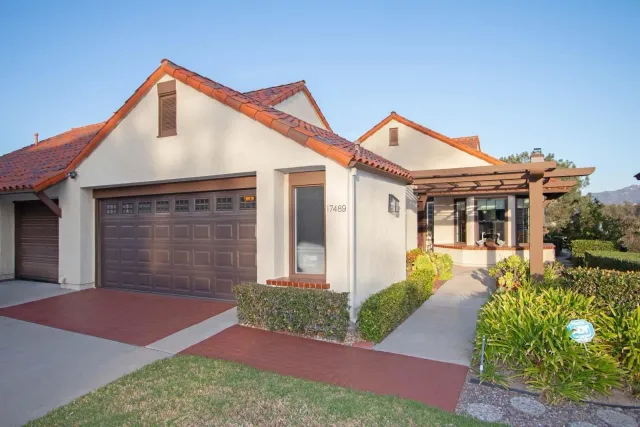 a front view of a house with a yard and porch