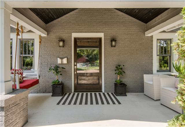 3518 Murphy Road Nashville, TN 37205 - Photo 2 of 20 a view of outdoor space that has two windows and flower plants