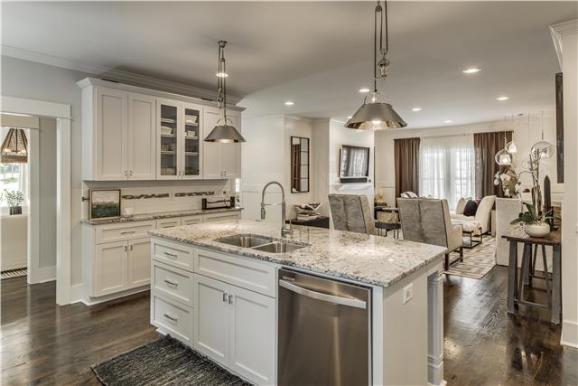 3518 Murphy Road Nashville, TN 37205 - Photo 6 of 20 a kitchen with stainless steel appliances granite countertop a sink stove and cabinets
