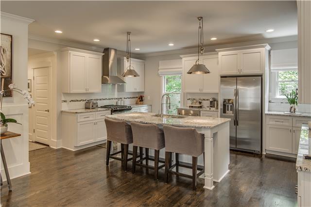 3518 Murphy Road Nashville, TN 37205 - Photo 8 of 20 a kitchen with kitchen island granite countertop a sink cabinets and stainless steel appliances