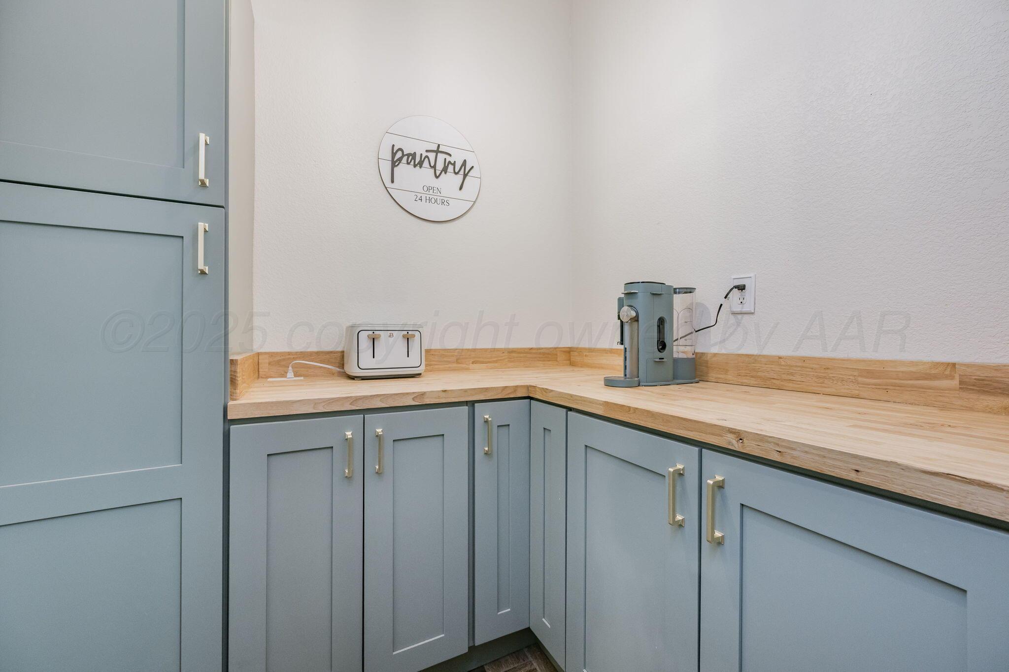1404 Southwest 61st Avenue Amarillo, TX 79118 - Photo 13 of 30 a kitchen with a sink and cabinets