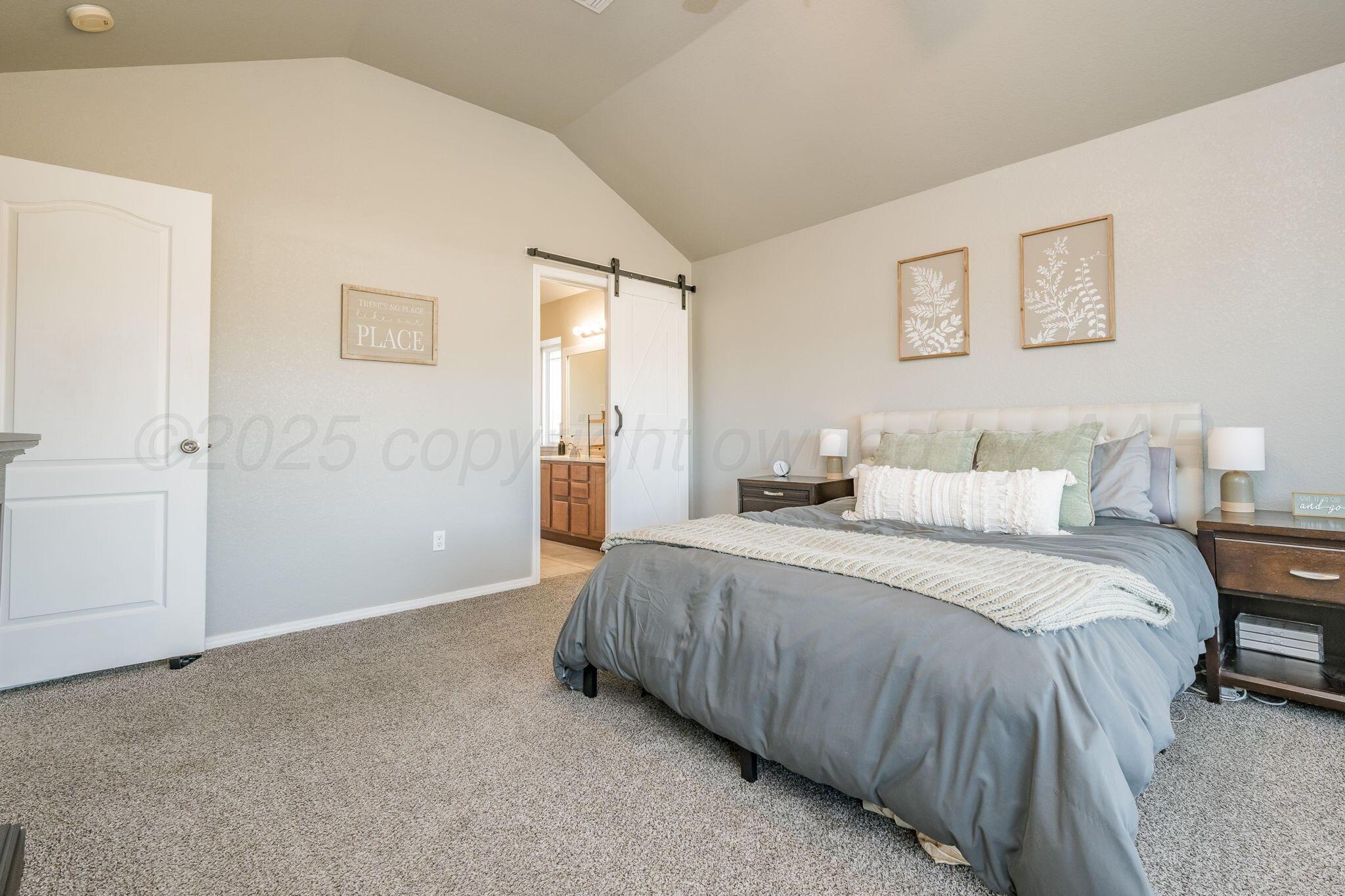 1404 Southwest 61st Avenue Amarillo, TX 79118 - Photo 16 of 30 a spacious bedroom with a bed and a window
