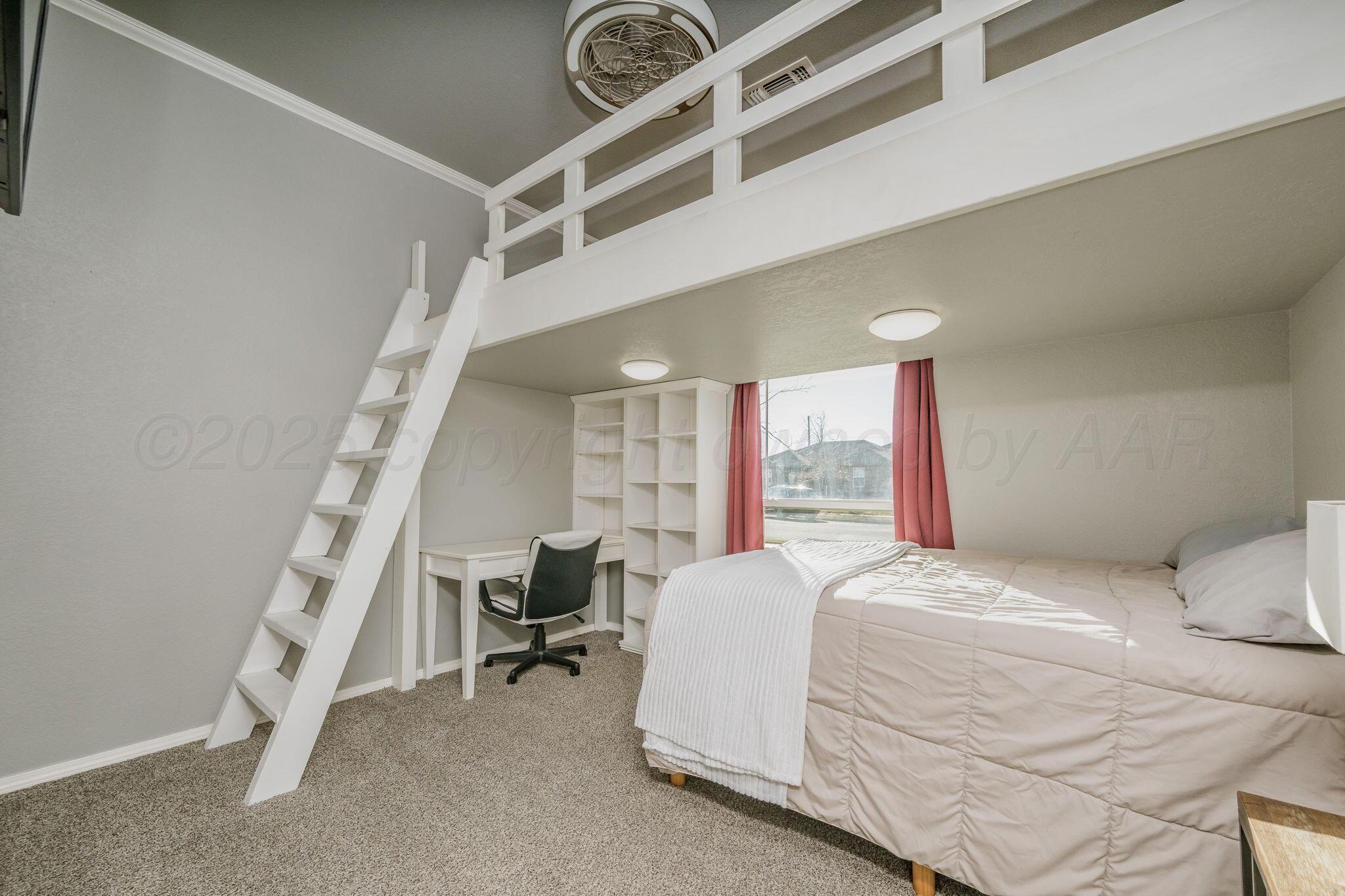 1404 Southwest 61st Avenue Amarillo, TX 79118 - Photo 20 of 30 a bedroom with a bed and a chandelier