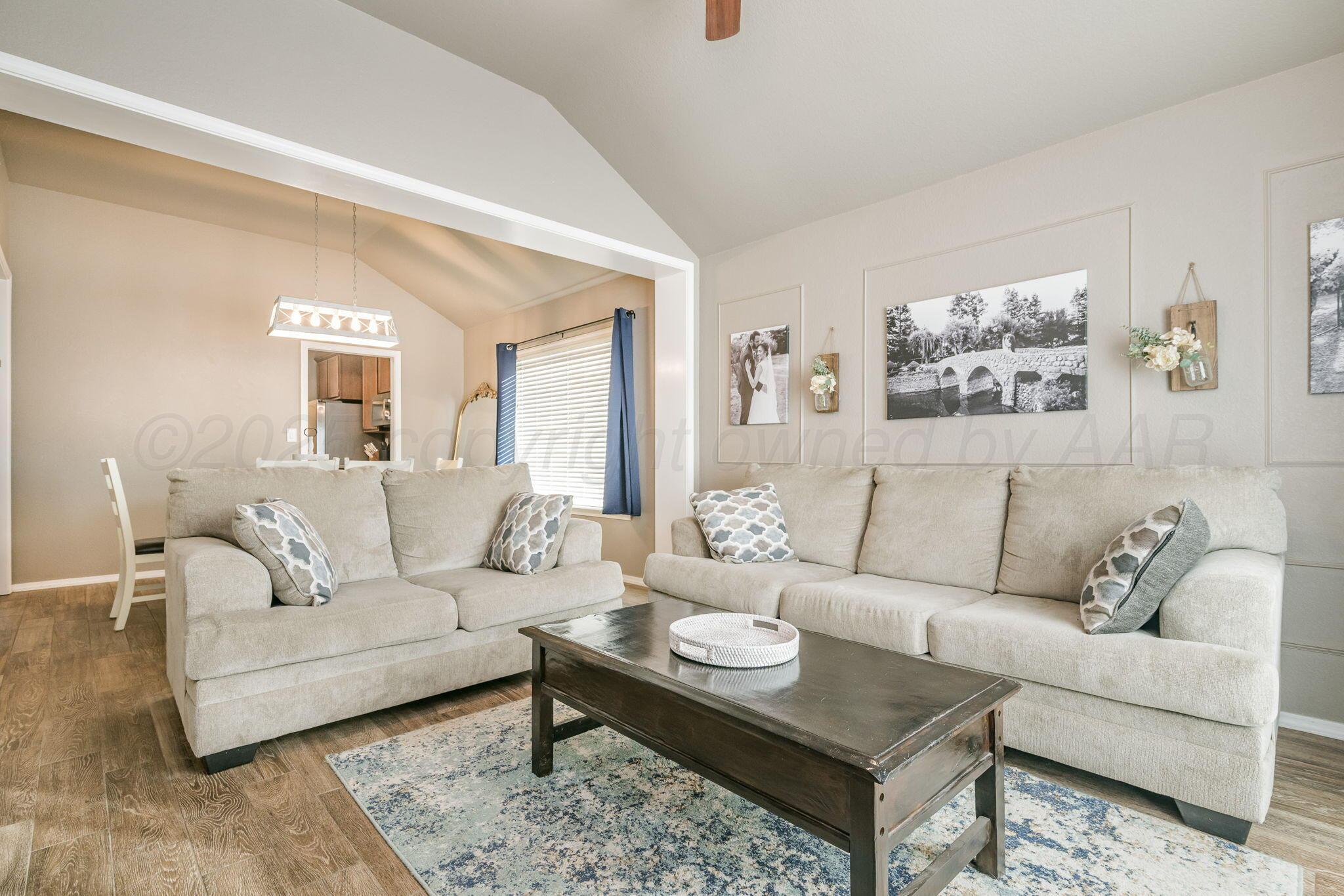 1404 Southwest 61st Avenue Amarillo, TX 79118 - Photo 5 of 30 a living room with furniture and a rug