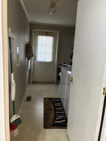 a view of bathroom with a sink dryer and gate