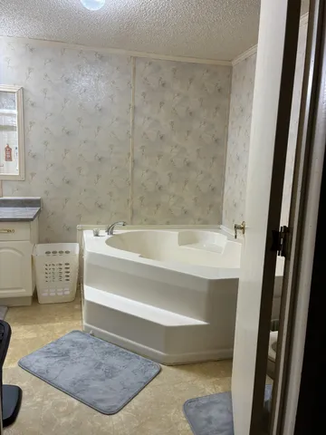 a bathroom with a bathtub and a sink