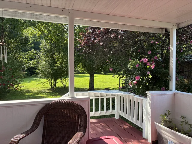 a view of a porch with furniture