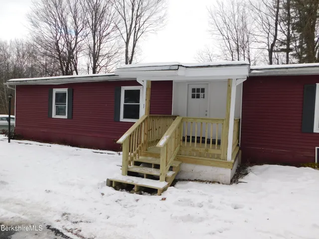 a view of backyard with a small barn