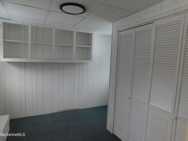 a view of a livingroom with shelf