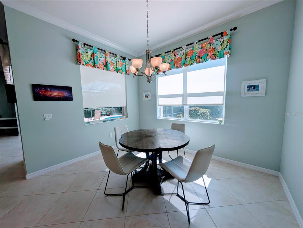 343 Marsh Creek Road Venice, FL 34292 - Photo 11 of 30 a dining room with furniture and window