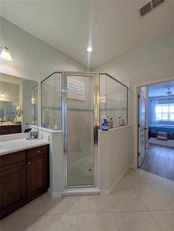 343 Marsh Creek Road Venice, FL 34292 - Photo 13 of 30 a bathroom with a double vanity sink mirror and shower