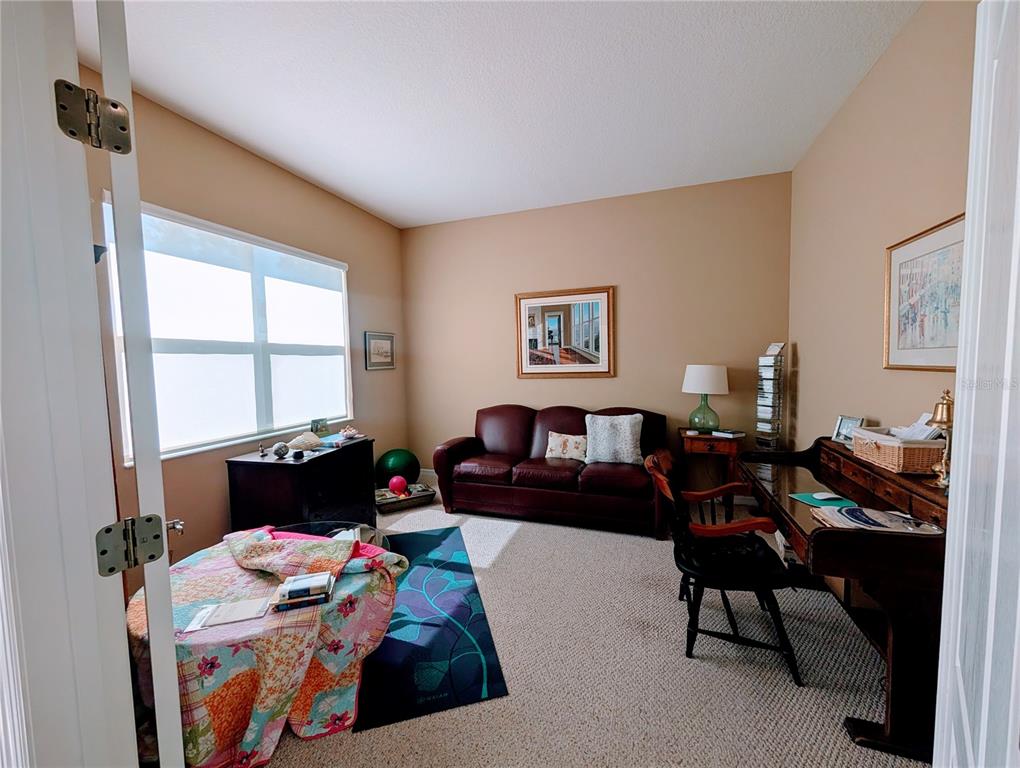 343 Marsh Creek Road Venice, FL 34292 - Photo 17 of 30 a living room with furniture and a window